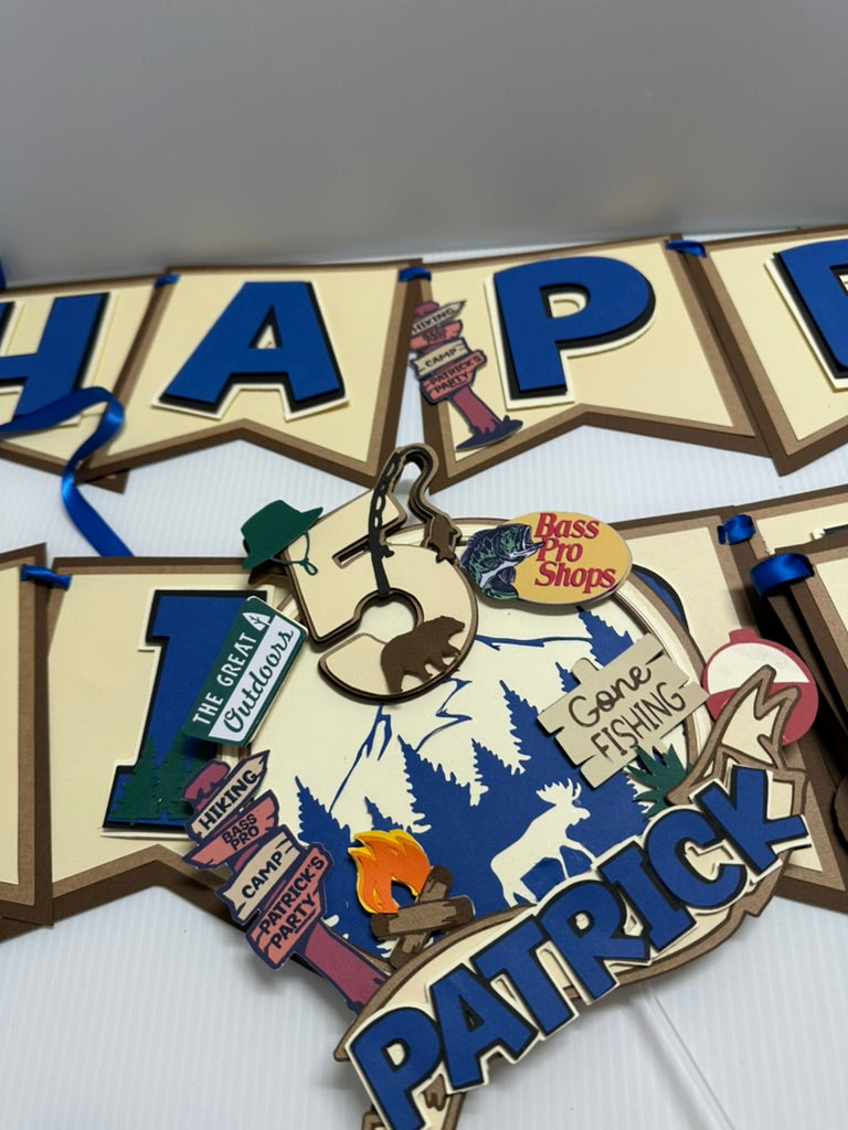 Custom bass pro shop theme cake topper with child's name and age with matching banner in the back