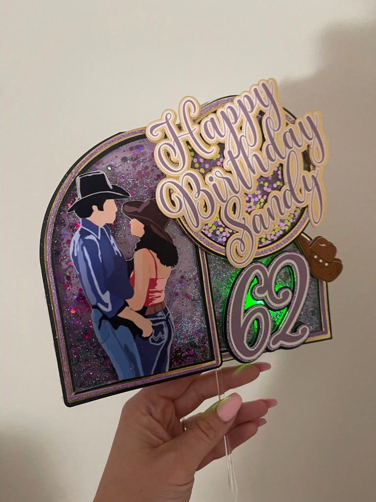Custom urban cowboy movie theme cake topper with "Happy Birthday" in purple and gold